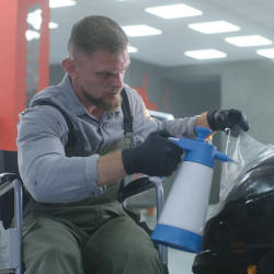 A brain injured man returning to work in a car body shop after brain injury