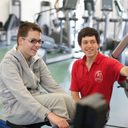 Liam (who has a brain injury) enjoying his brain injury rehabilitation plan at the gym with his personal trainer