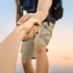 A walker provides a helping hand to someone who has fallen illustrating advice and support for people thinking about making a personal injury claim