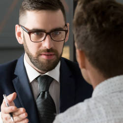 A couple listen to their legal adviser illustrating what to expect from a legal adviser