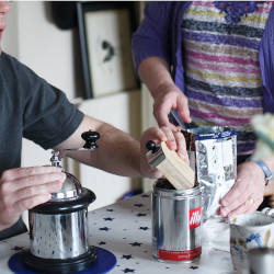 A brain injured man sits at the breakfast table illustrating he role of the Occupational Therapist