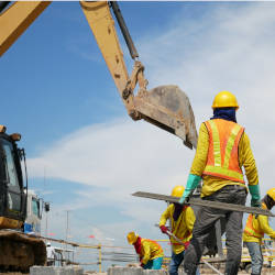 Workers on a construction site with heavy machinery illustrating accidents at work and Kieran's story