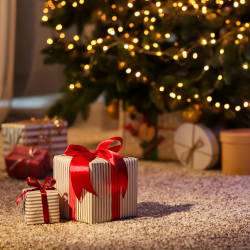 Christmas gifts under the tree illustrating our Christmas gift guide for deputies and attorneys
